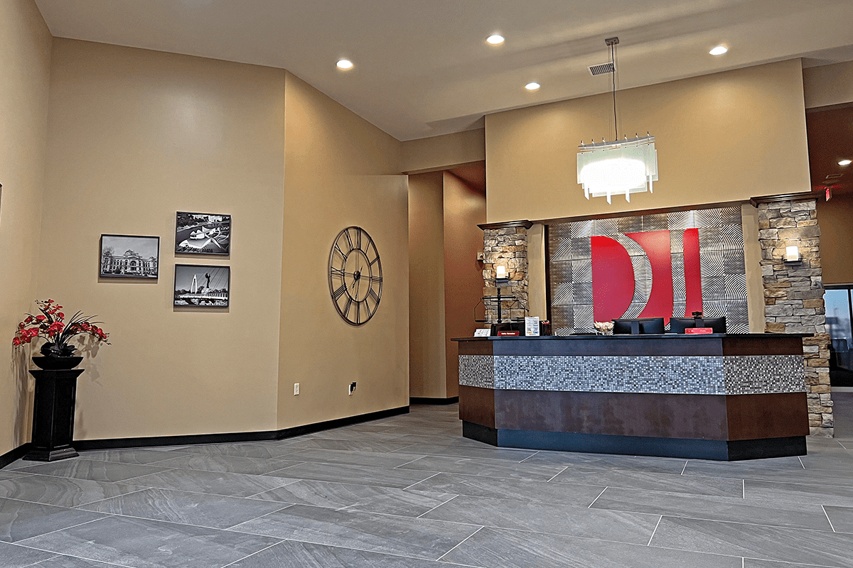 office lobby with chandelier and wall art