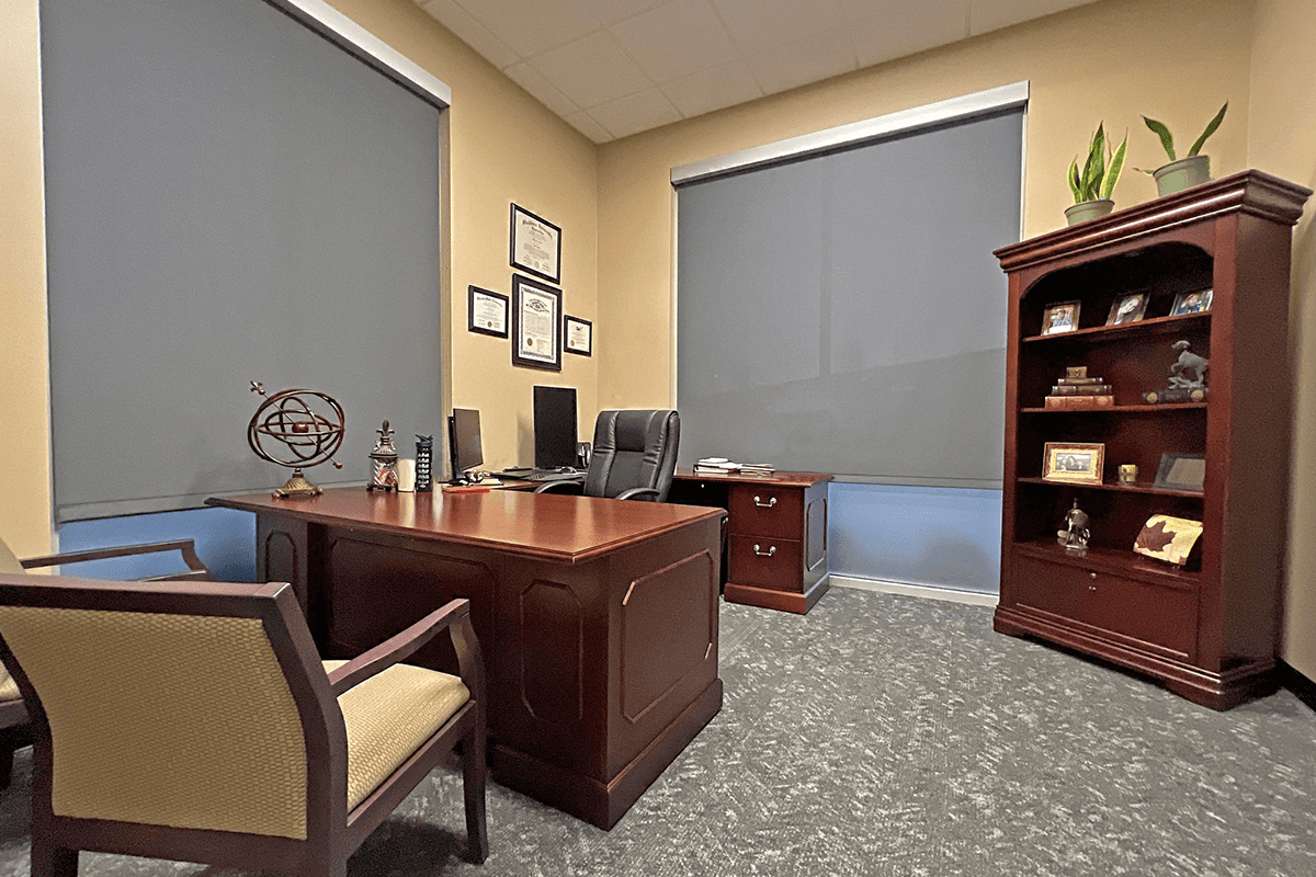 office with desk, chair, and bookcase