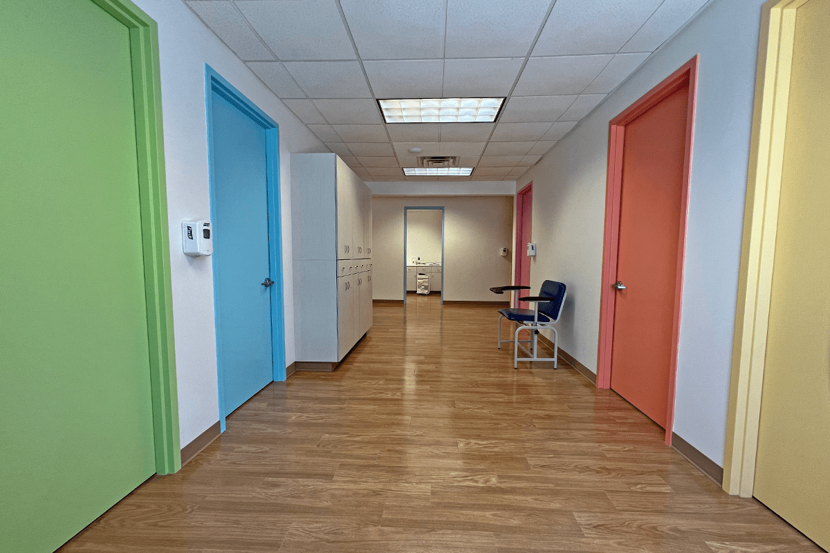 hallway with bright multicolored doors