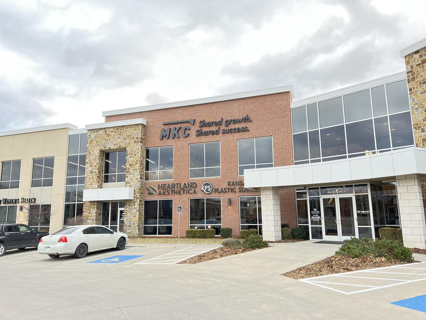 An exterior photo of a multi-tenant building