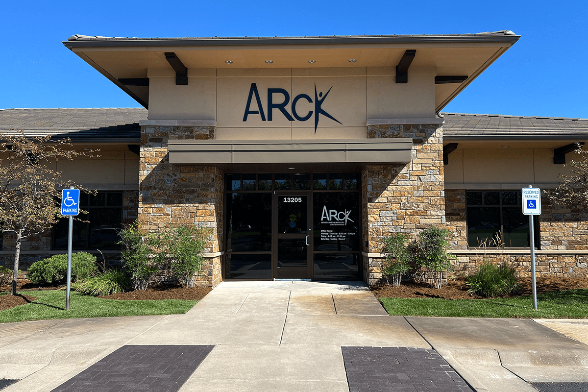 Exterior of a medical office with signage, masonry, and landscaping.